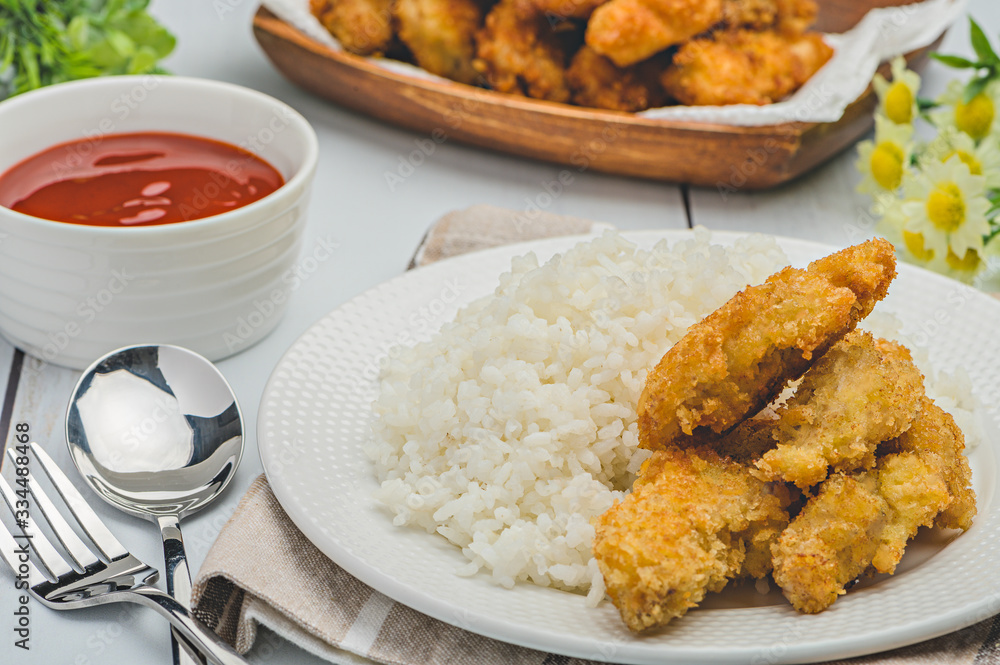 Homemade Chicken Fingers paired with white rice Homemade Chicken Fingers paired with white rice