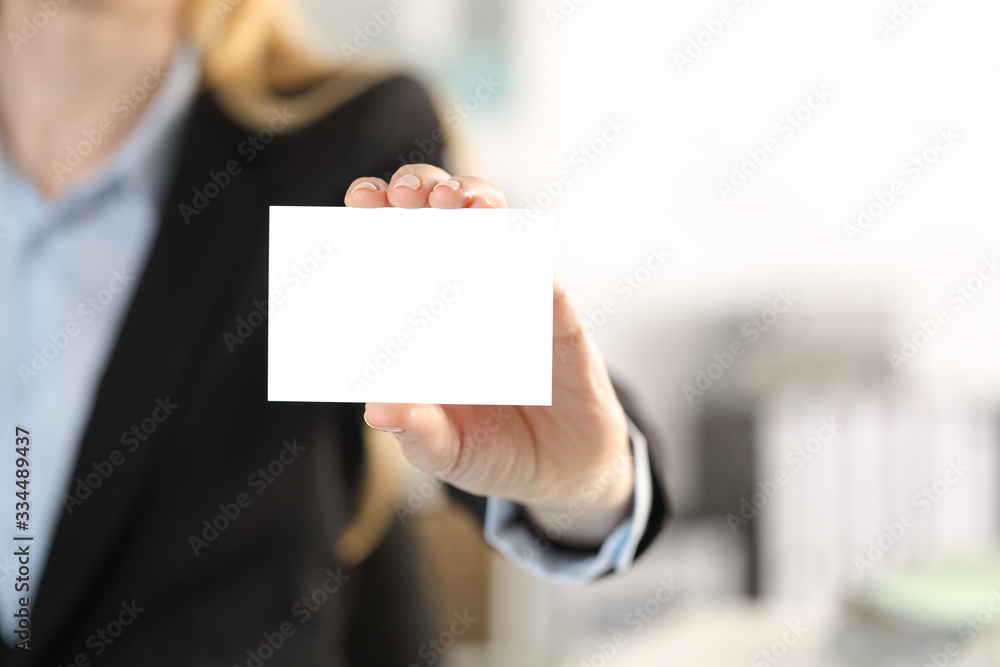Executive hand showing blank business card Executive hand showing blank business card