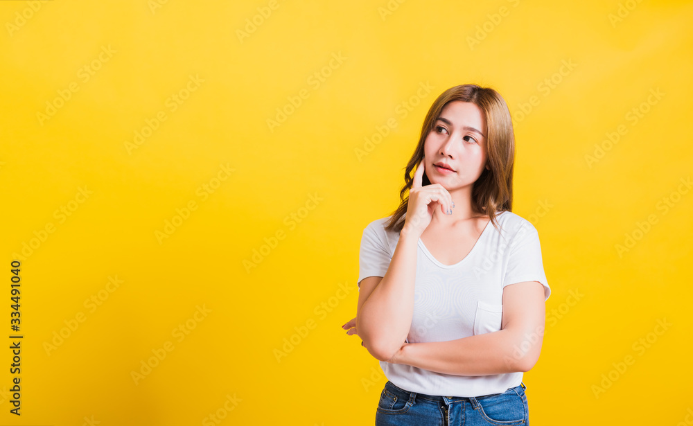 woman smile wear white t-shirt standing relaxed thinking about something about question woman smile wear white t-shirt standing relaxed thinking about something about question