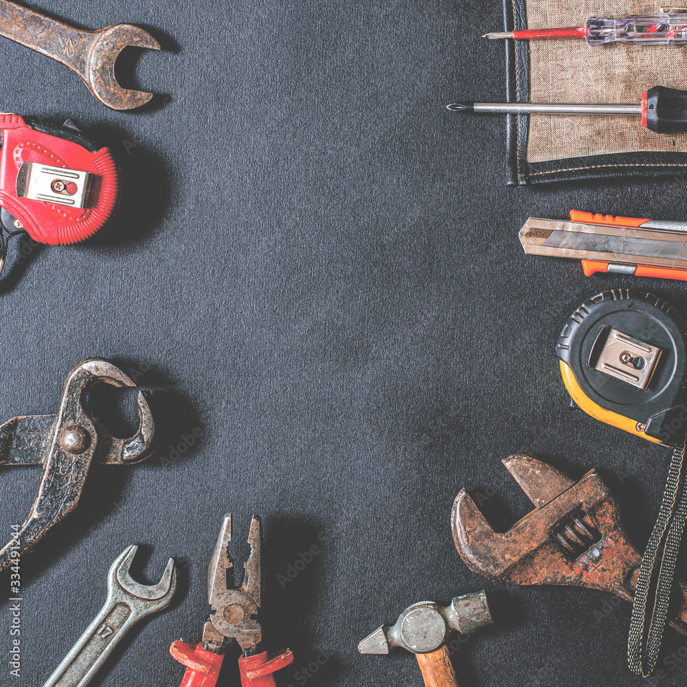 Obraz premium Tools for repair and reconstruction in home conditions lie on a black background