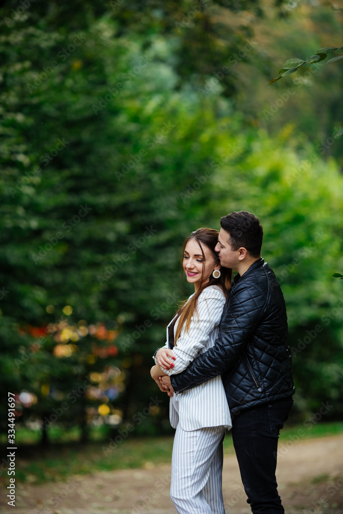 couple in love at sunset, gives a bouquet of flowers