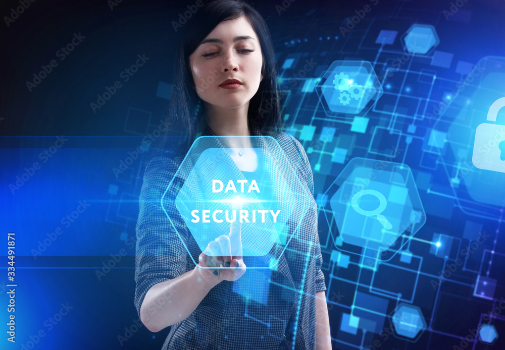 Business, Technology, Internet and network concept. Young businessman working on a virtual screen of the future and sees the inscription: Data security Business, Technology, Internet and network concept. Young businessman working on a virtual screen of the future and sees the inscription: Data security