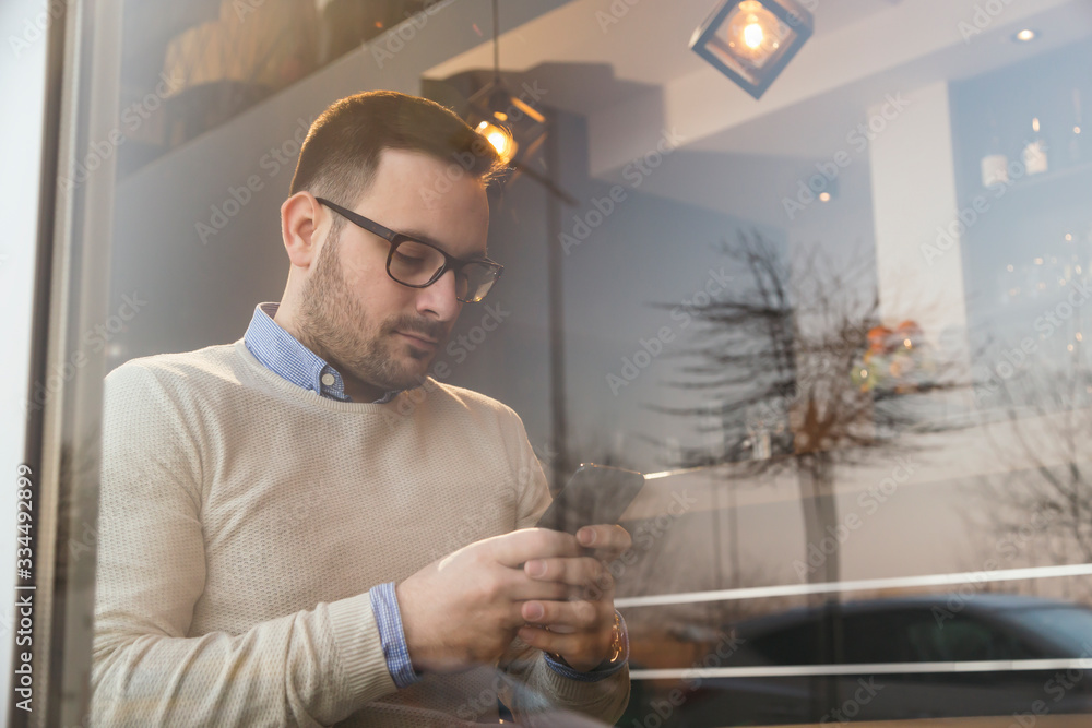 Man sending an email on a smart phone Man sending an email on a smart phone
