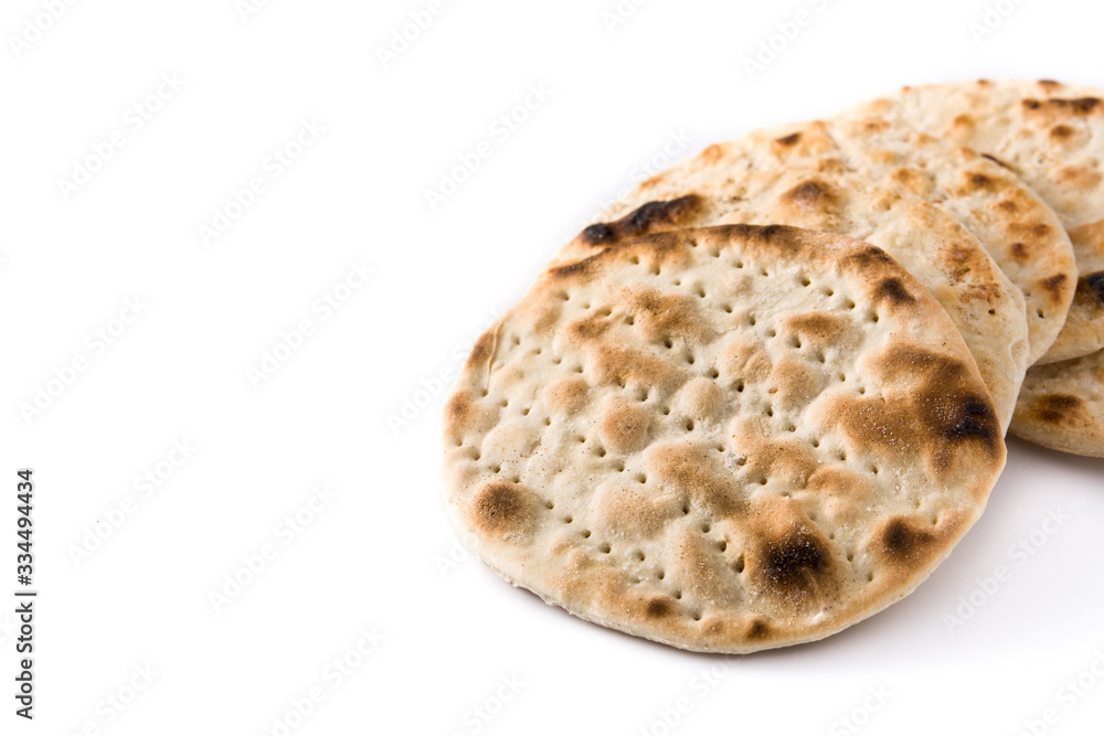 Handmade matzah for Jewish Passover isolated on white background.Copy space	