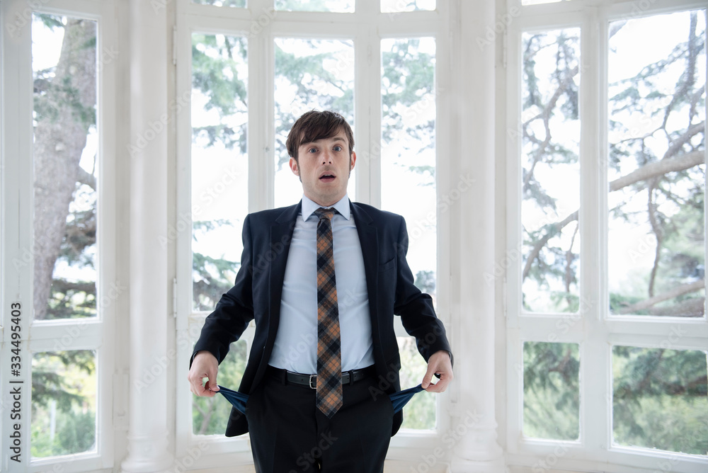 Man in a suit with empty pockets Man in a suit with empty pockets