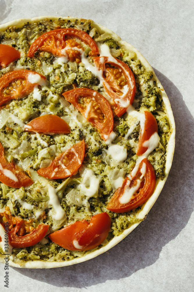 Vegetable pie with spinach, broccoli and tomatoes. Vegan cuisine. Vegetable pie with spinach, broccoli and tomatoes. Vegan cuisine.