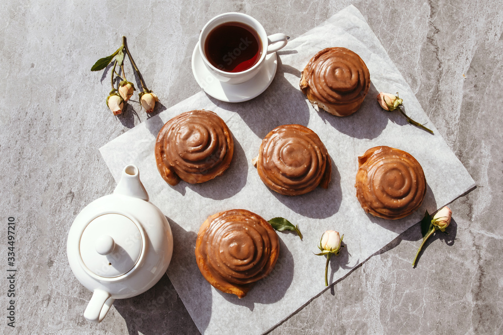 Cinnamon rolls and cream. Tea party. Still life. Cinnamon rolls and cream. Tea party. Still life.