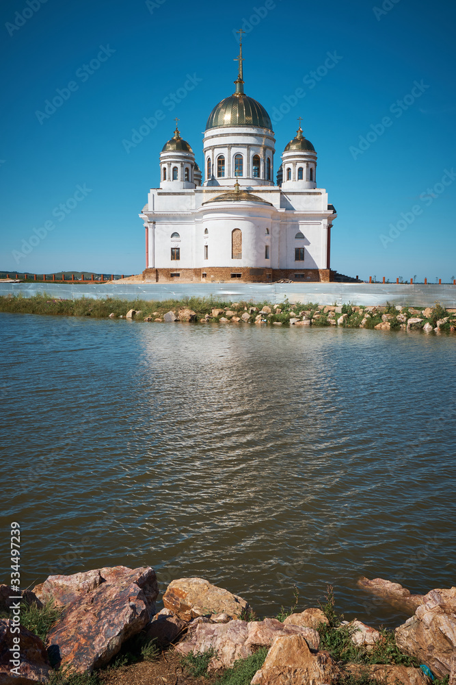 White Orthodox Church on the Shore of the Lake