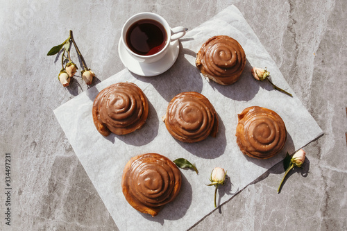 Cinnamon rolls and cream. Tea party. Still life.