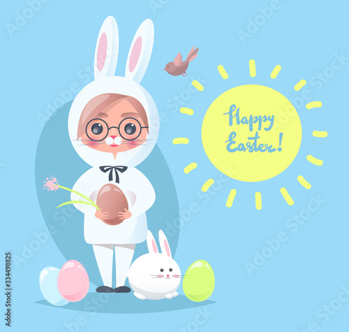 Baby boy in a rabbit costume. Easter greeting card.
