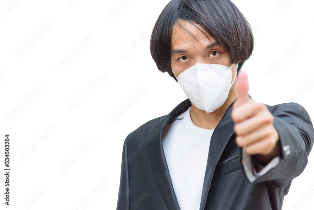 A asian man wear N95 mask and show his hand thum up A asian man wear N95 mask and show his hand thum up