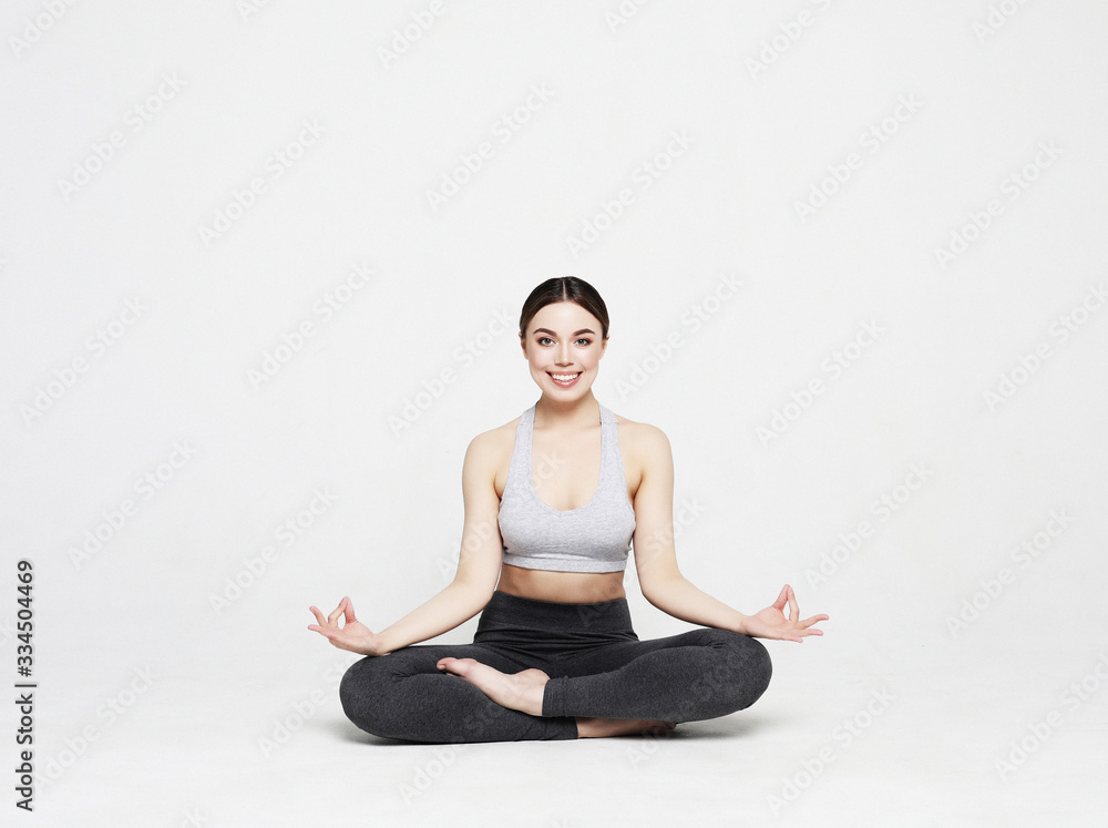 sport, yoga and people concept - lovely young woman doing yoga, sports exercises for relaxation and meditation sport, yoga and people concept - lovely young woman doing yoga, sports exercises for relaxation and meditation