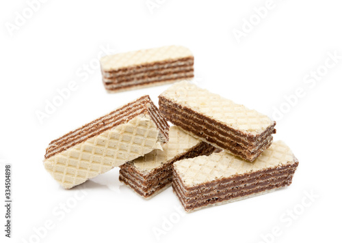 Crispy wafers with creamy hazelnut filling isolated on white background