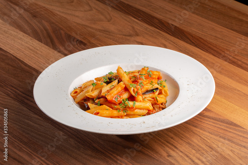 details of fresh pasta with tomato and veggie, italian style