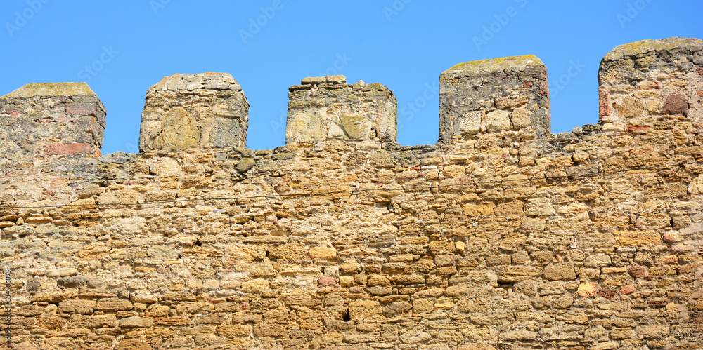 3-meter thick fortified limestone wall of an old Bilhorod-Dnistrovskyi, Akkerman fortress in Ukraine of the 14th century.