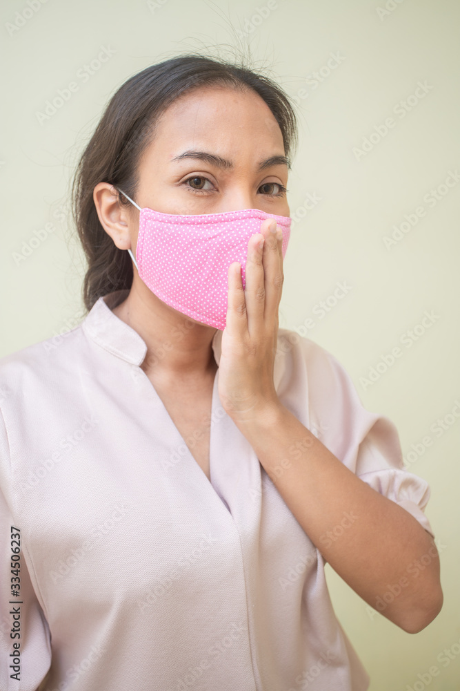 Women concerned about the Covid-19 virus And her mask Women concerned about the Covid-19 virus And her mask