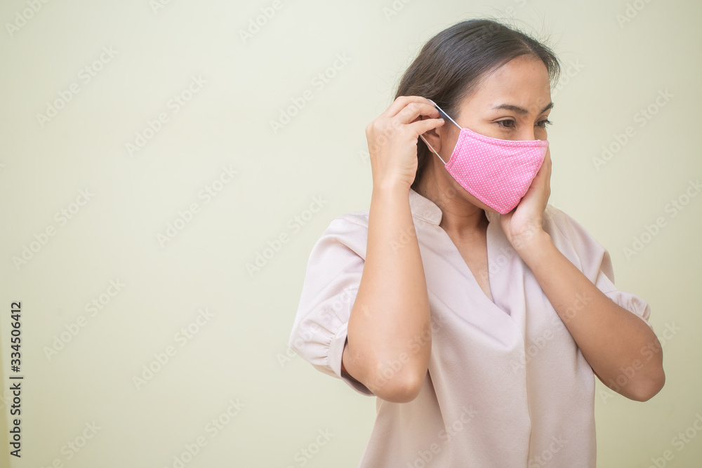 Women concerned about the Covid-19 virus And her mask Women concerned about the Covid-19 virus And her mask