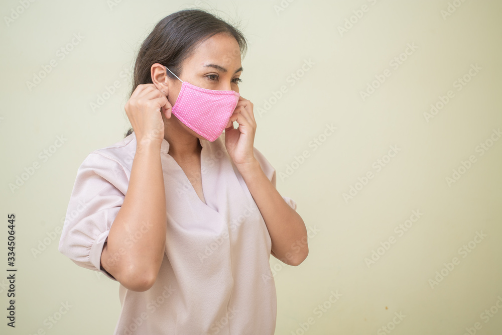 Women concerned about the Covid-19 virus And her mask Women concerned about the Covid-19 virus And her mask