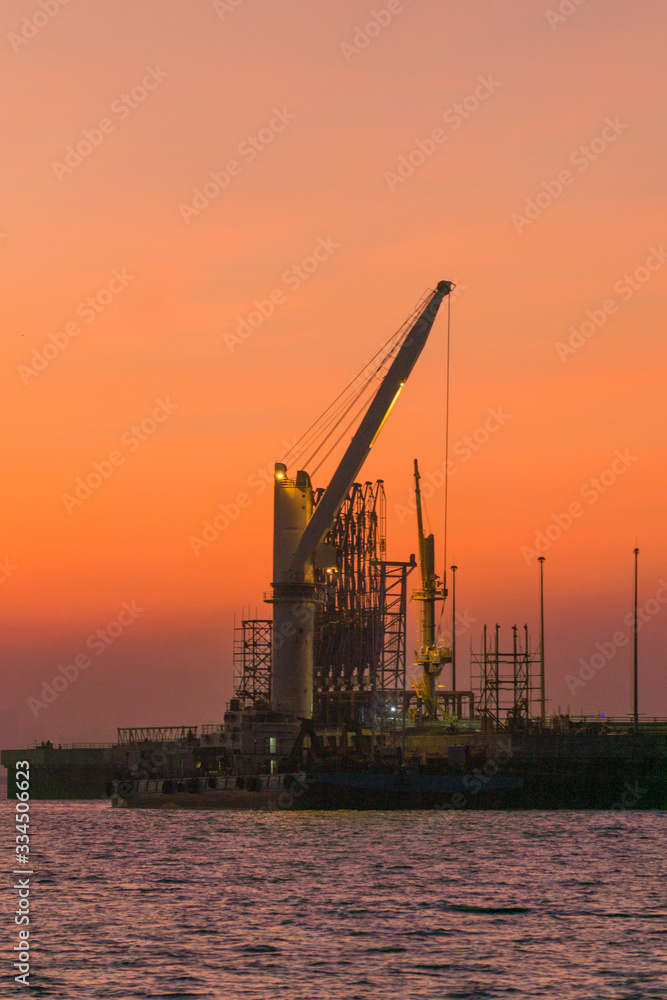 oil refinary at sunset