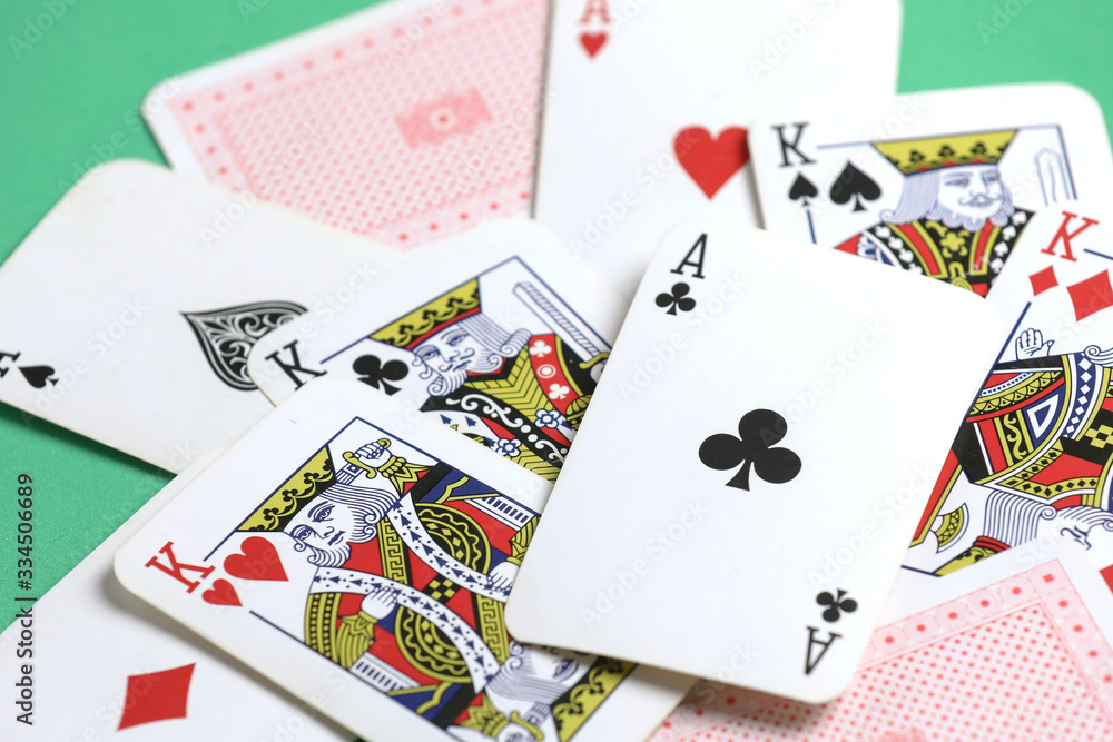 playing cards on the green poker table. Gambling. Addiction. Bets playing cards on the green poker table. Gambling. Addiction. Bets
