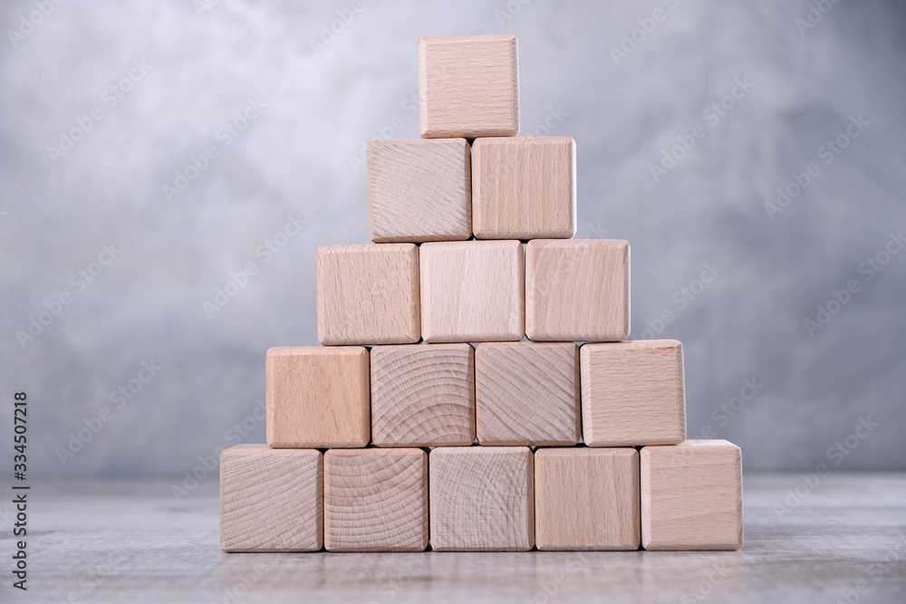One blank wooden cube with space for your word, letter, symbol on the table. Place for text, free copy space One blank wooden cube with space for your word, letter, symbol on the table. Place for text, free copy space