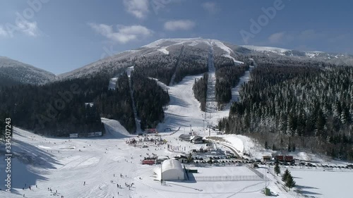 Snow mountain full of people skiing Bjelasnica photo