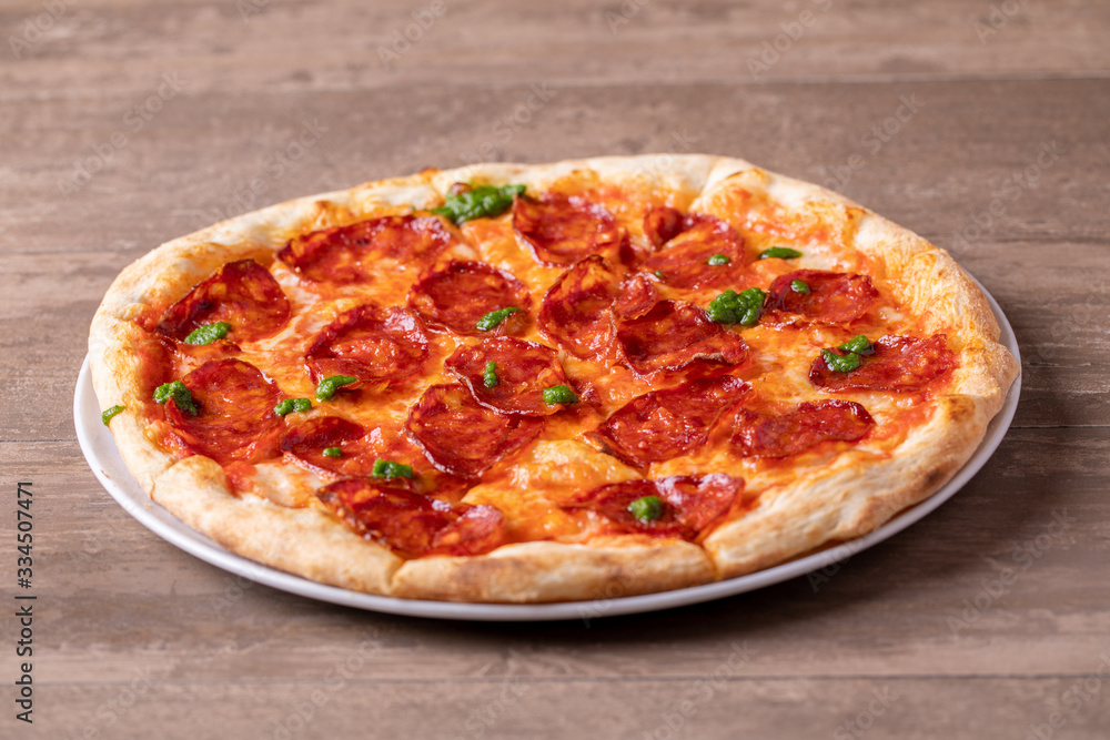 details of tasty fresh baked pesto spicy pizza