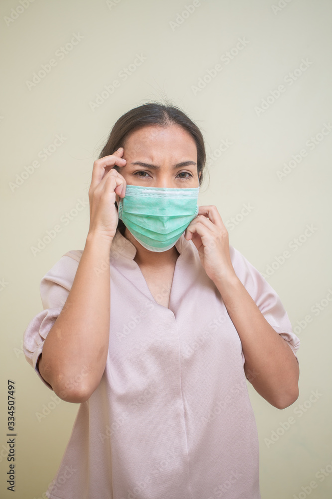 Women concerned about the Covid-19 virus And her mask Women concerned about the Covid-19 virus And her mask