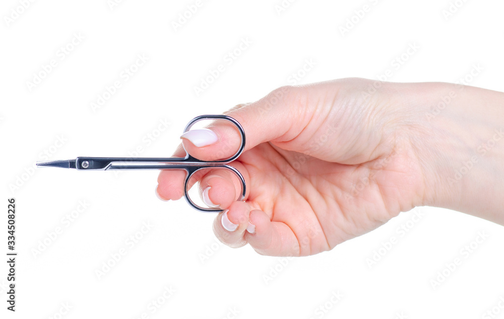 Nail scissors in hand on white background isolation Nail scissors in hand on white background isolation