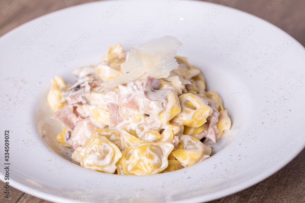 details of fresh, hot tortellini carbonara, with parmesan details of fresh, hot tortellini carbonara, with parmesan