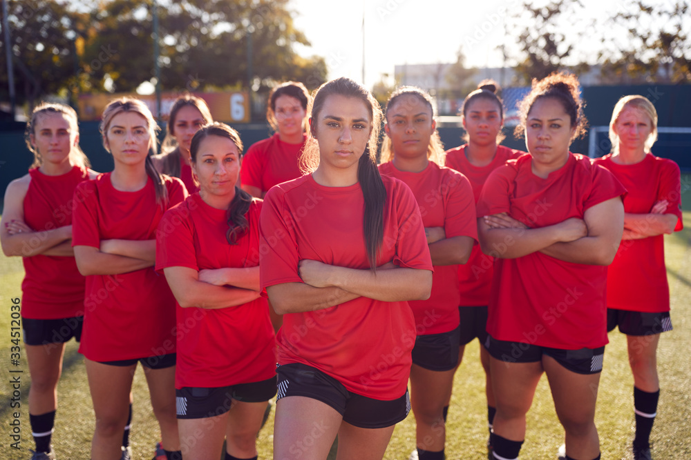 Obraz premium Portrait Of Womens Football Team Training For Soccer Match On Outdoor Astro Turf Pitch