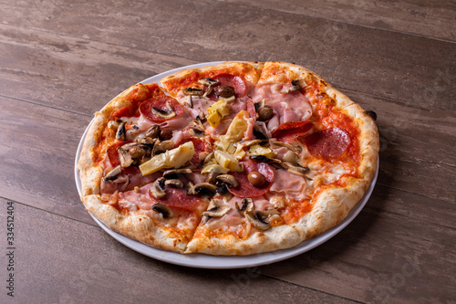details of tasty ham salami and mushrooms pizza