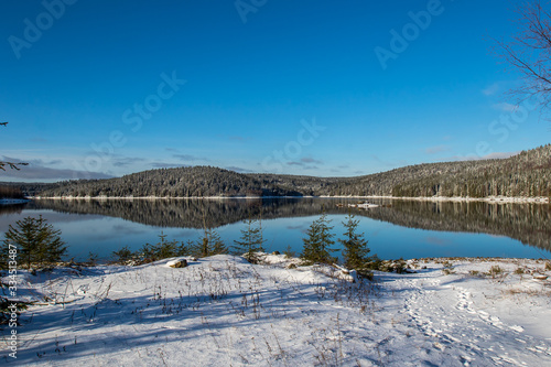Winter landscape of water reservoir Josefuv Dul in Jizera Mountains