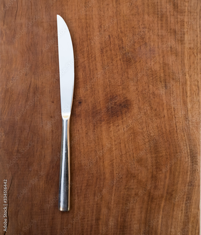 fork and knife on wooden background fork and knife on wooden background