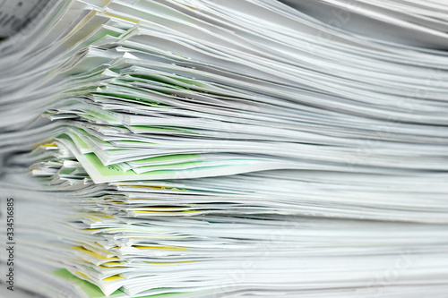 A stack of office papers on a table.