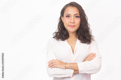 Curly hair woman with a pastel pink shirt