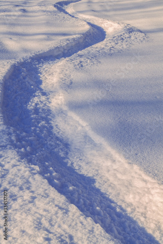 Snowboarder tracks in the snow