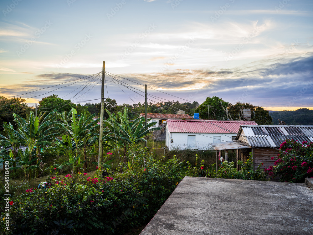 Sunrise behind local houses in the valley of Vinales, Cuba
