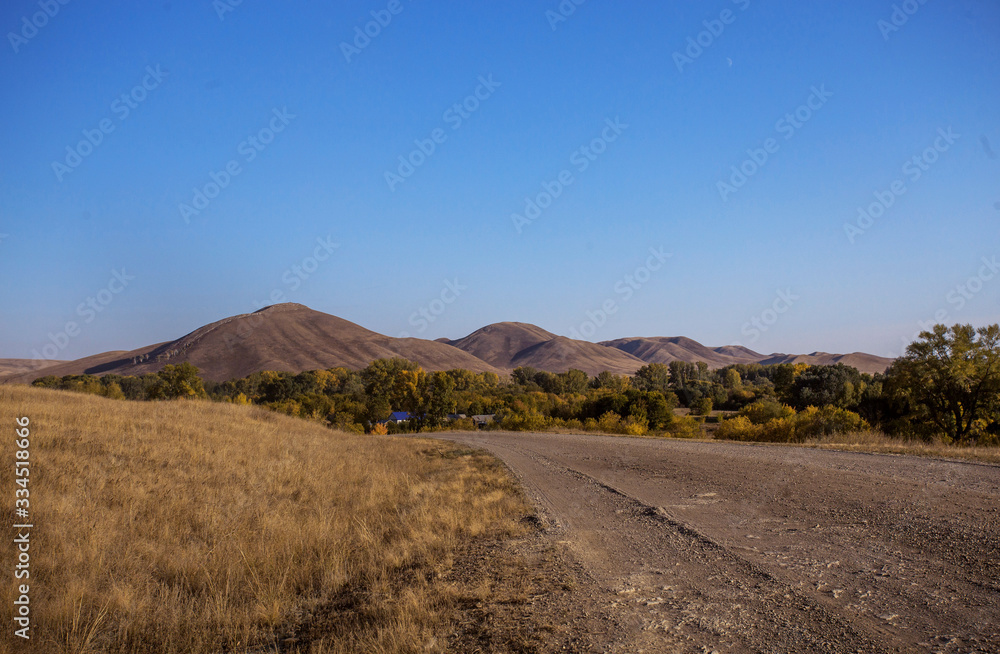 Landscape Steppe hills in autumn at sunset Landscape Steppe hills in autumn at sunset