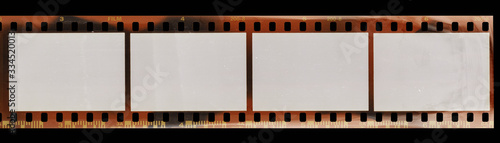 Start of 35mm negative film strip with empty cells, real scan of film material with cool scanning light interferences on the material. photo