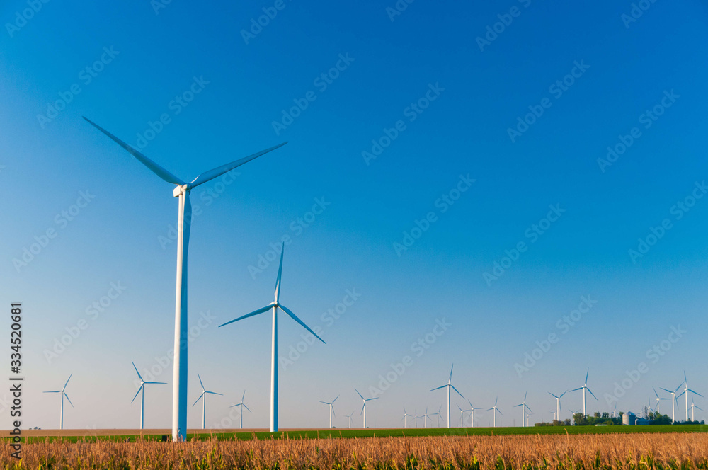 Large wind turbine farm against a blue sky at sunset, Dexter, Minnesota, USA Large wind turbine farm against a blue sky at sunset, Dexter, Minnesota, USA