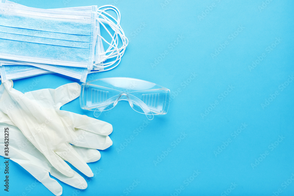 Medical Surgeon face protection kit for Medical Worker, doctor nurse. Protective surgical face mask, goggles,gloves. Prevention coronavirus, Covid-19. Concept medicine health care.Long blue banner Medical Surgeon face protection kit for Medical Worker, doctor nurse. Protective surgical face mask, goggles,gloves. Prevention coronavirus, Covid-19. Concept medicine health care.Long blue banner