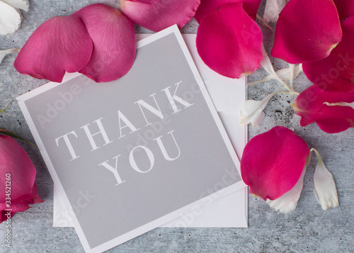 Fotografie Fancy Greeting card  close up to express thanks with posh red rrose petals from