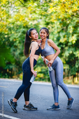 Women exercise happily for good health. Exercise concept