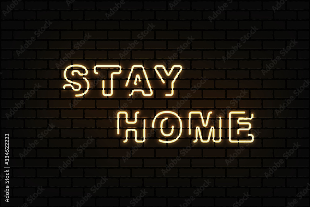 Obraz premium Stay home brightly sign in neon style on dark brick wall . Coronavirus Covid-19 pandemic protection and prevention effort. Social activity message. Quarantine.