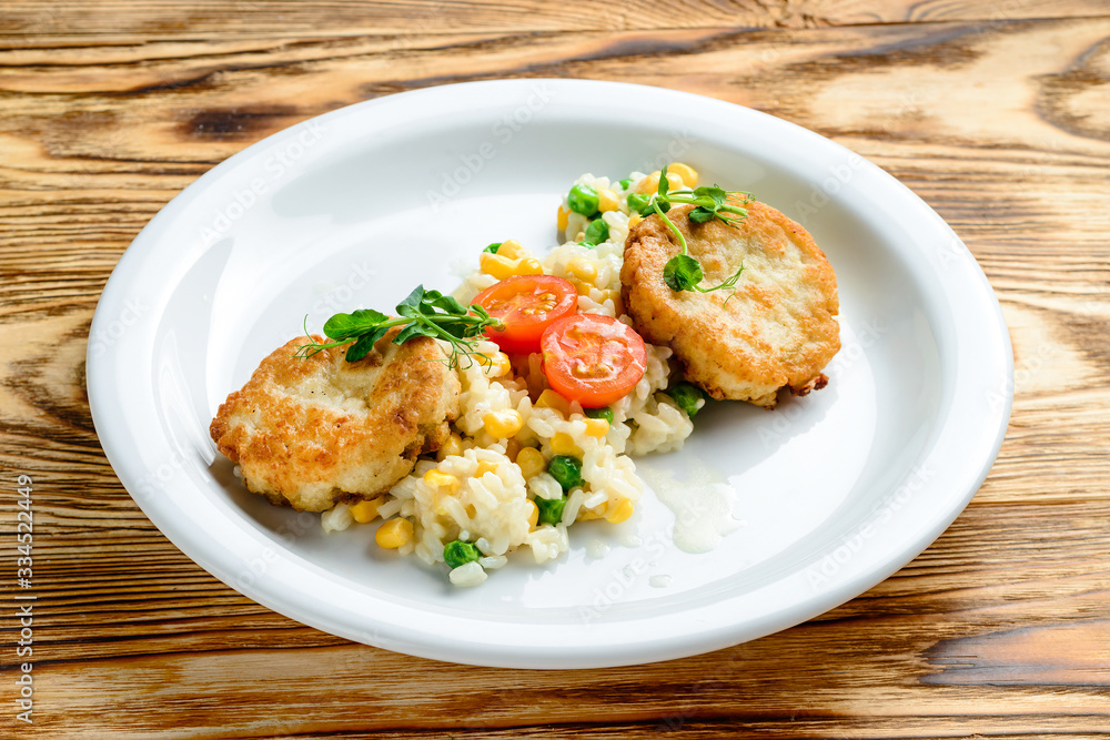 chicken cutlet with a plan with a side dish of rice chicken cutlet with a plan with a side dish of rice