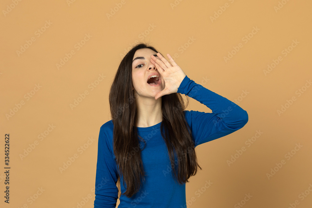 Brunette young girl wearing blue jersey Brunette young girl wearing blue jersey