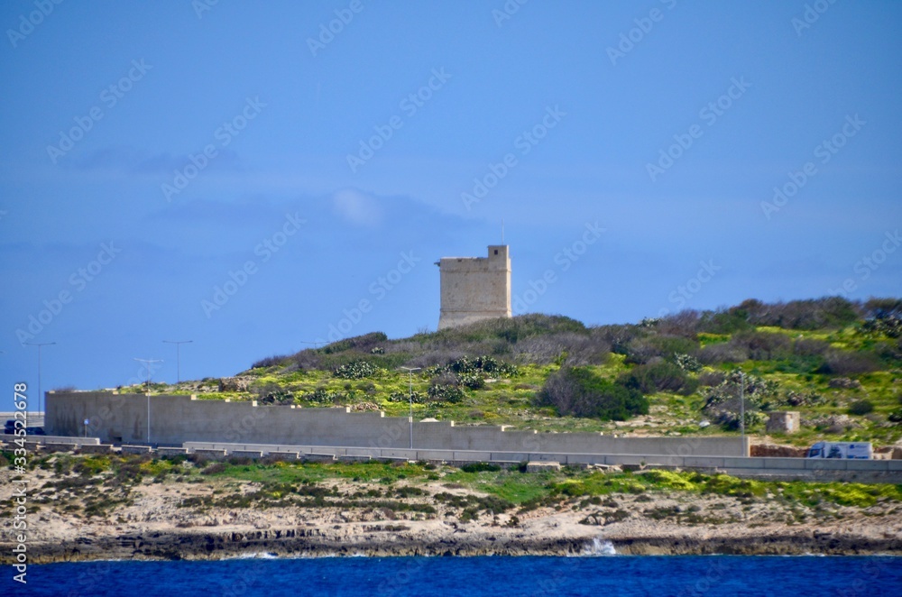 Stone watch tower fortification overlooking St Paul's bay in Malta