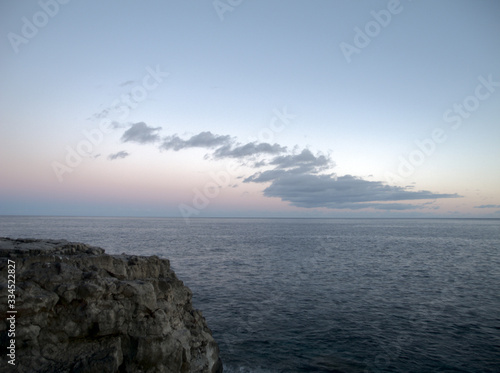 Sunset over calm Caribbean waters in Rock Sound, Eleuthera. photo