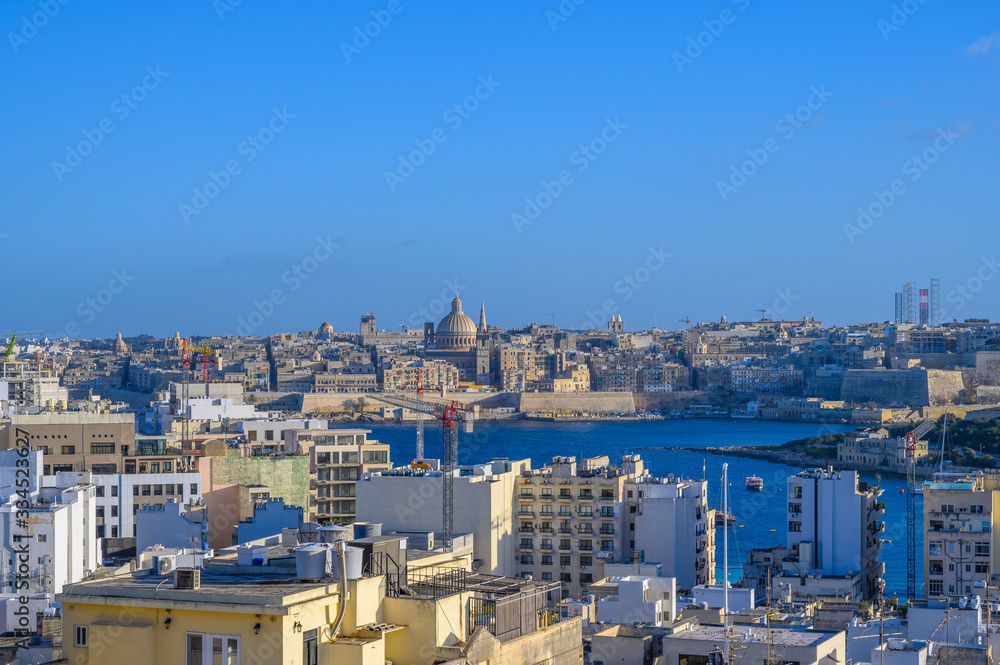 View of Valletta Skyline looking across the harbour from the town of Sliema in Malta.
